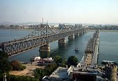 https://upload.wikimedia.org/wikipedia/commons/thumb/a/ae/Dandong%2C_Liaoning_Province.jpg/170px-Dandong%2C_Liaoning_Province.jpg